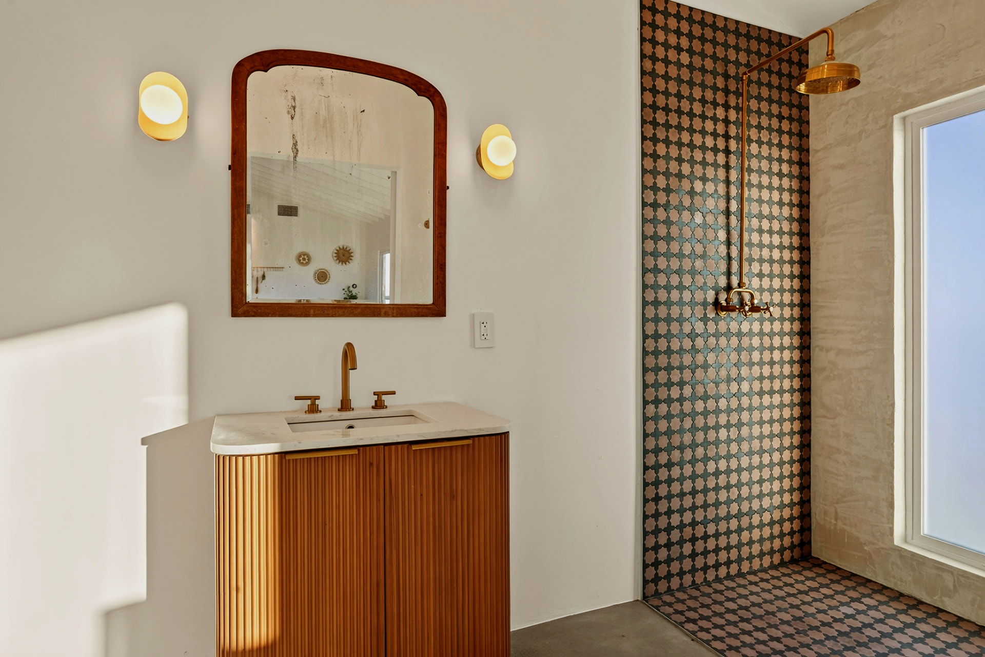 Casita bath with fluted vanity and tiled walk-in shower